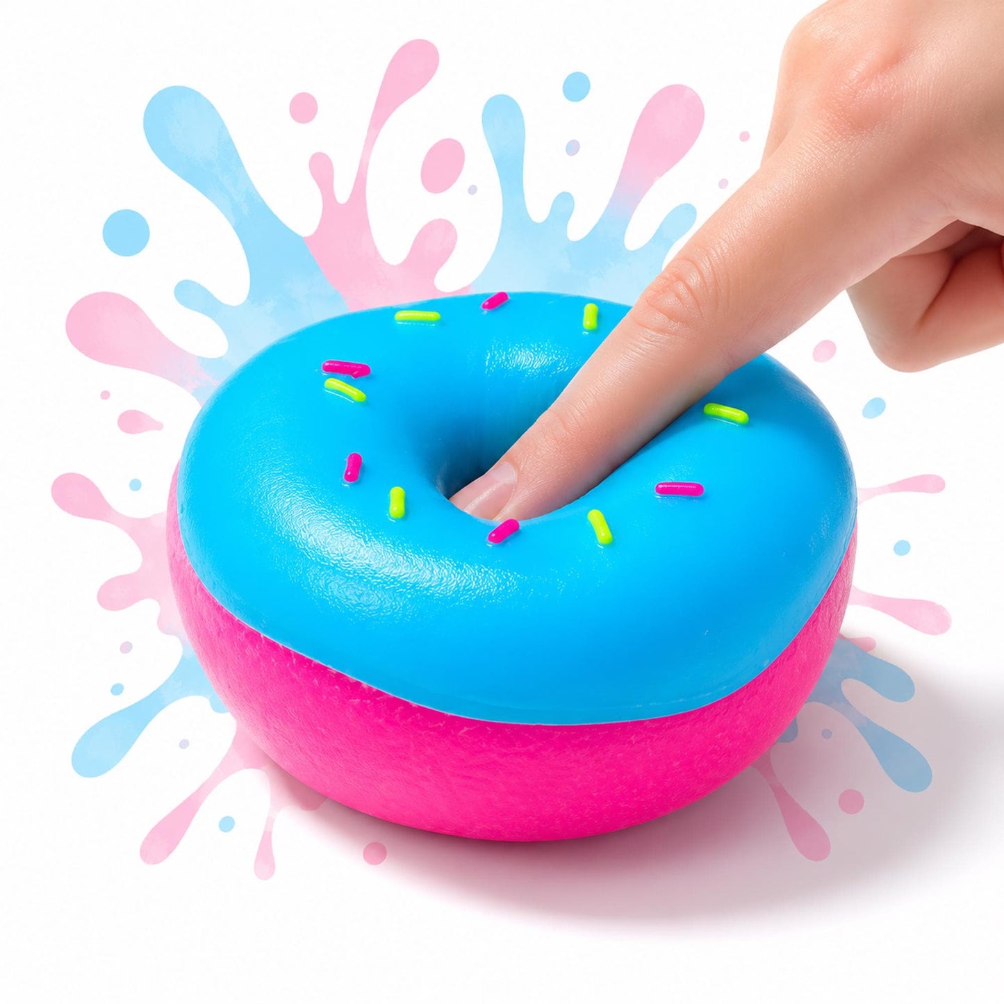 May include: A bright blue donut-shaped squishy toy with a vibrant pink base and colorful sprinkles on top. The surface is smooth and rounded, featuring a central hole. A finger is pressing into the center, showing the soft, flexible texture.